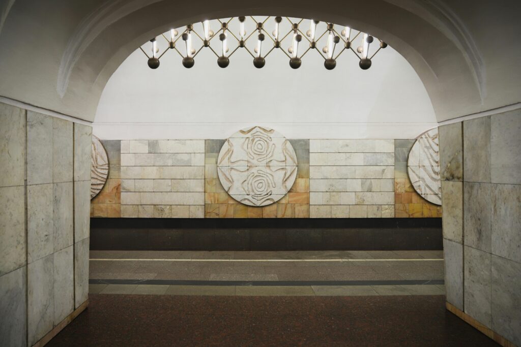 Intricate stonework and elegant design in a Moscow metro station interior.