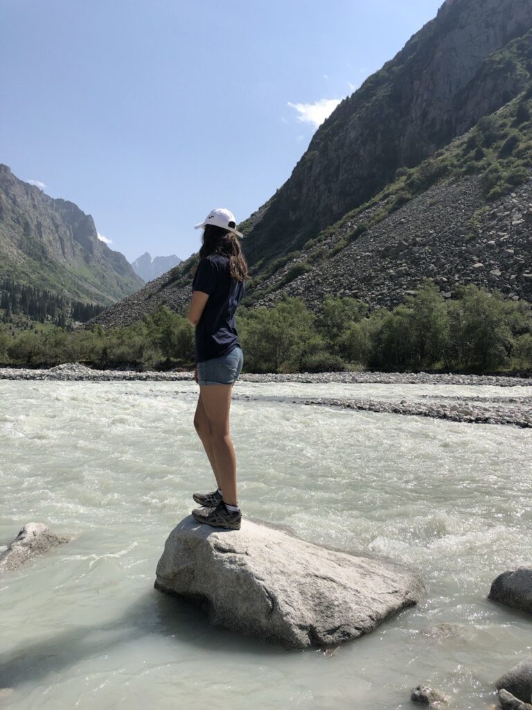 Ala Archa National Park, tourist on the stone