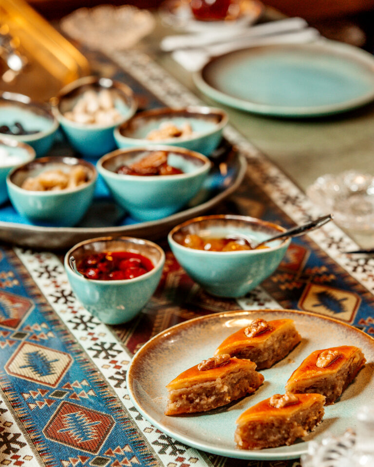 baklava some jams and dried fruits on the table