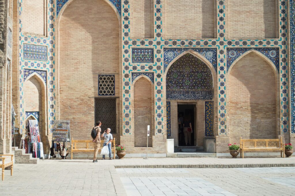 Stunning architectural facade of a mausoleum in Samarkand, Uzbekistan, showcasing intricate mosaic patterns.