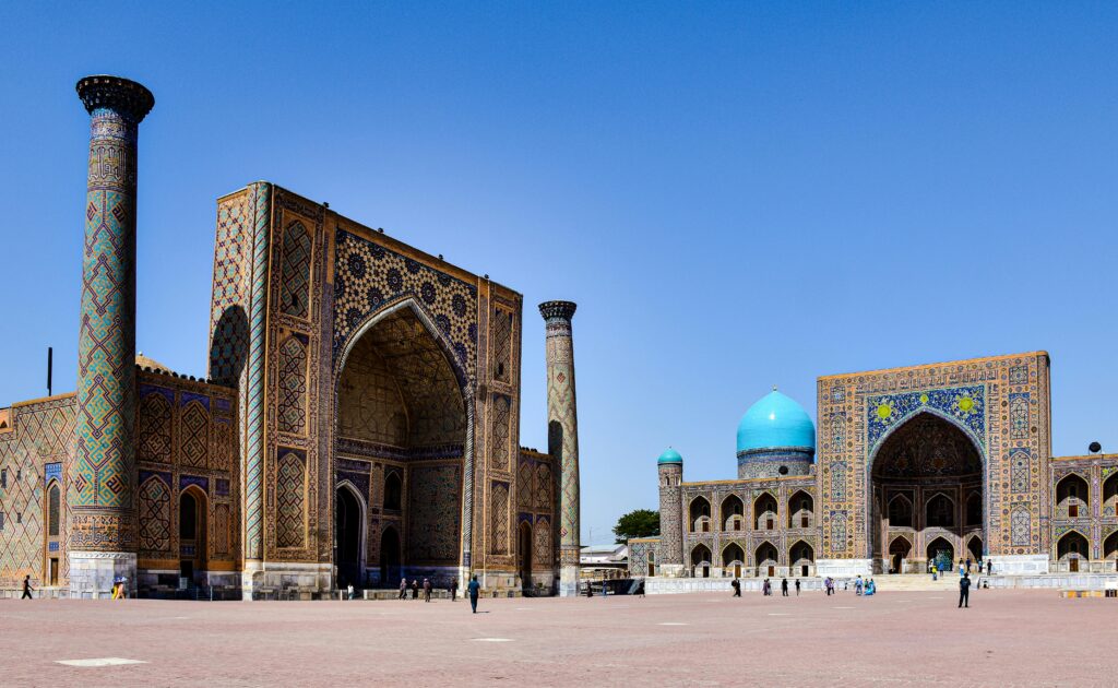 Explore the stunning architecture of Registan Square in Samarkand, Uzbekistan under a clear blue sky.