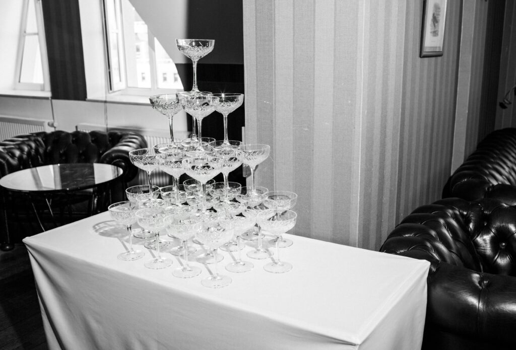 A sophisticated wine glass stack displayed on a table in a posh indoor setting, perfect for elegant events.