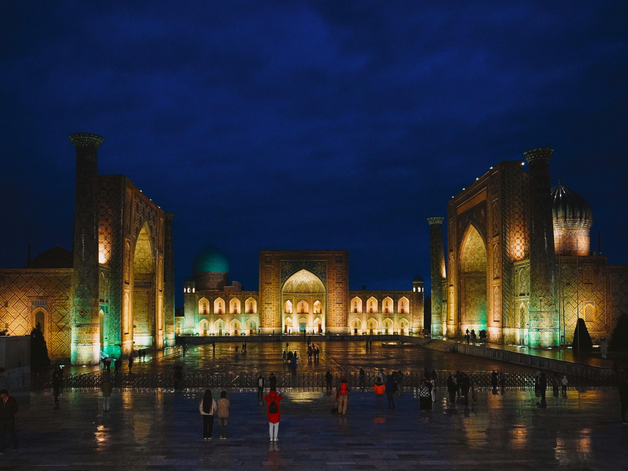 Enchanting night view of Registan Square in Samarkand, Uzbekistan, showcasing stunning Islamic architecture.