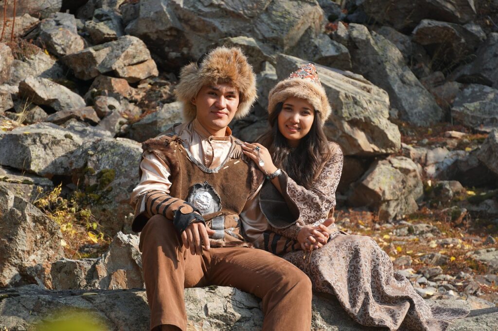 couple, happy, nature, love, girl, boy, smile, fashion, hats, clothing, traditional, kazakh, sitting, pose, outdoors, kazakh, kazakh, kazakh, kazakh, kazakh